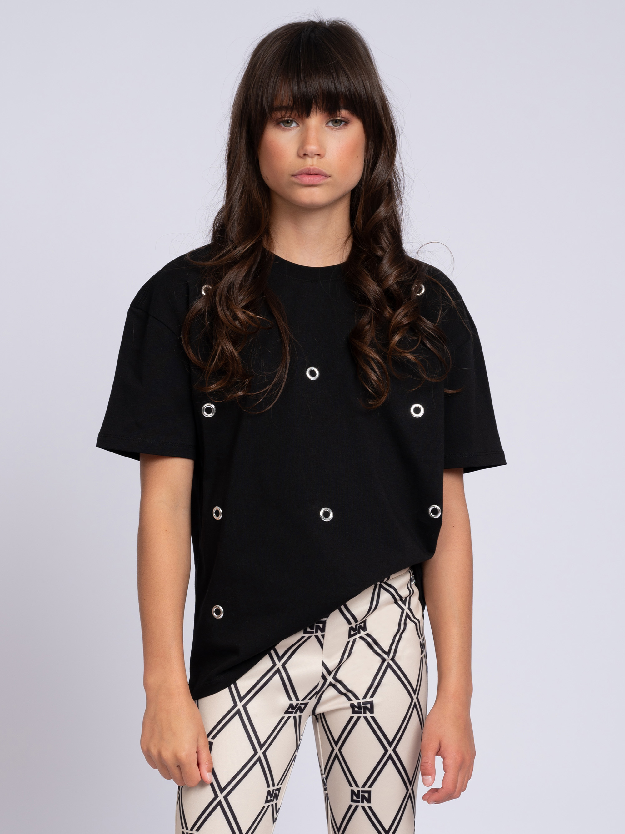 T-shirt with decorative rings