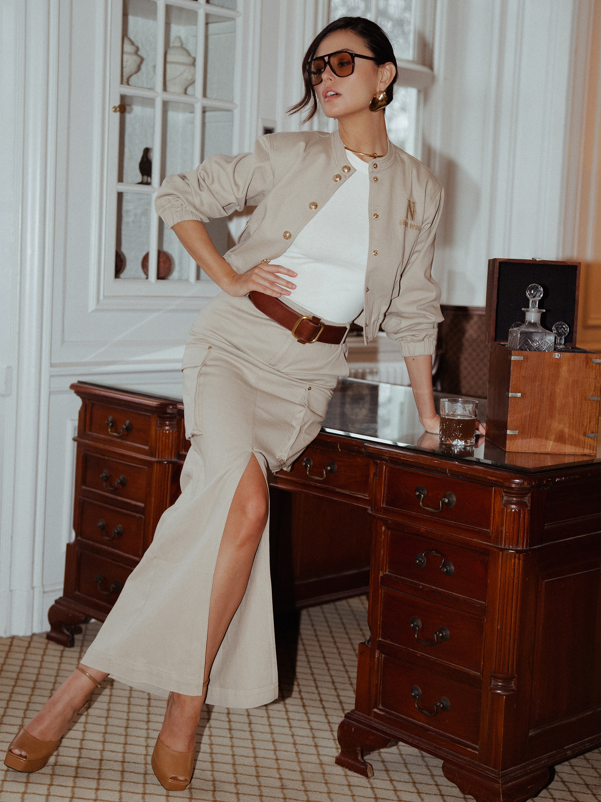 Long denim skirt with slit and flap pockets