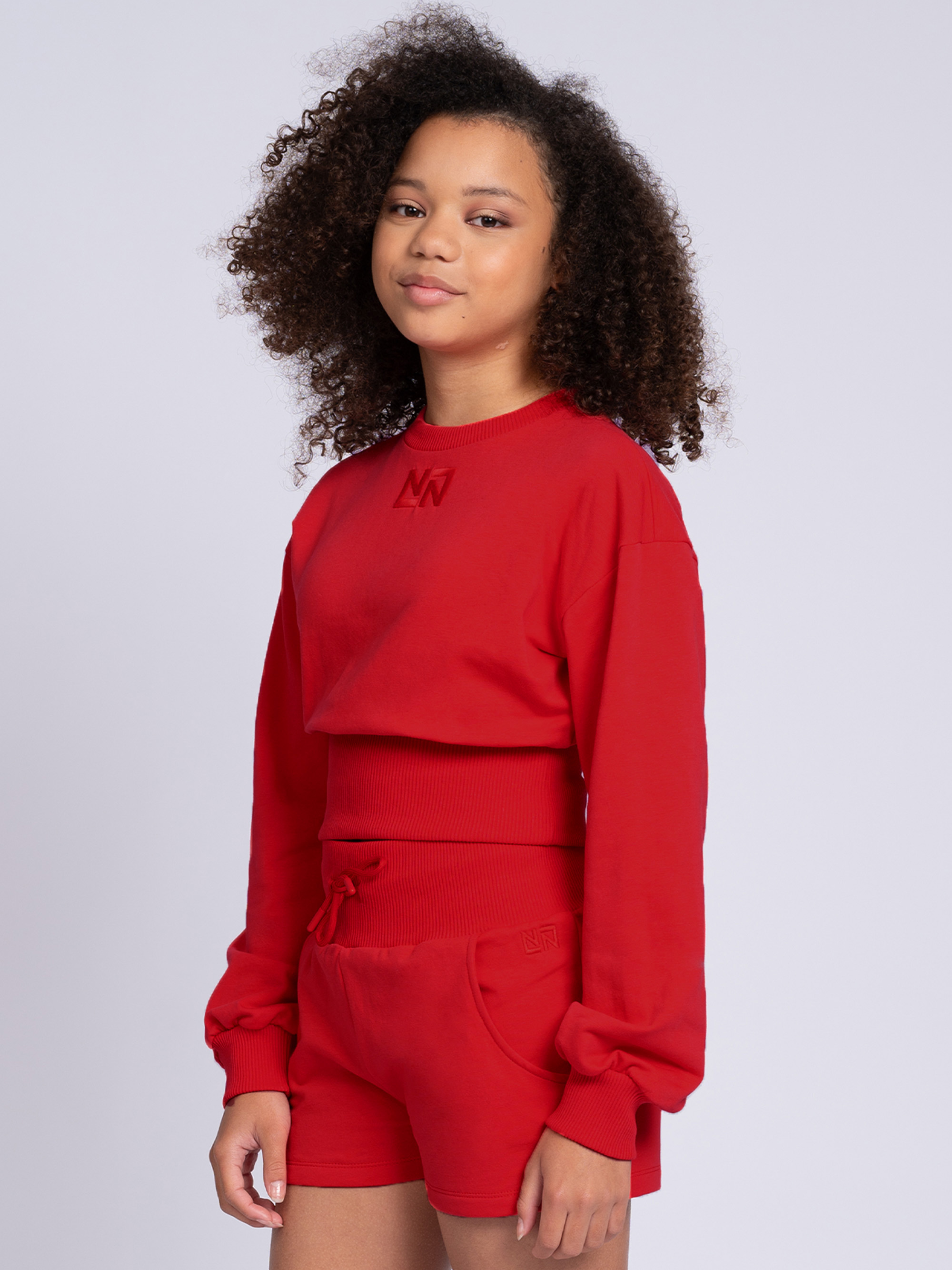 Cropped sweater with wide elastic waistband